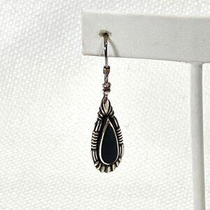Sterling silver and onyx dangle pierced earrings.